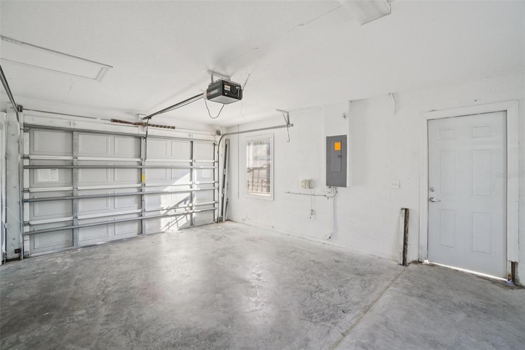 13210 Maple Street Odessa, FL 33556 - Photo 30 of 34 a view of an empty room with empty shelves
