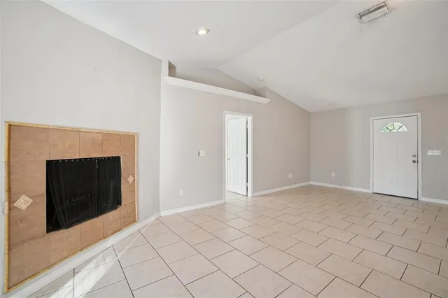 a view of an empty room and window