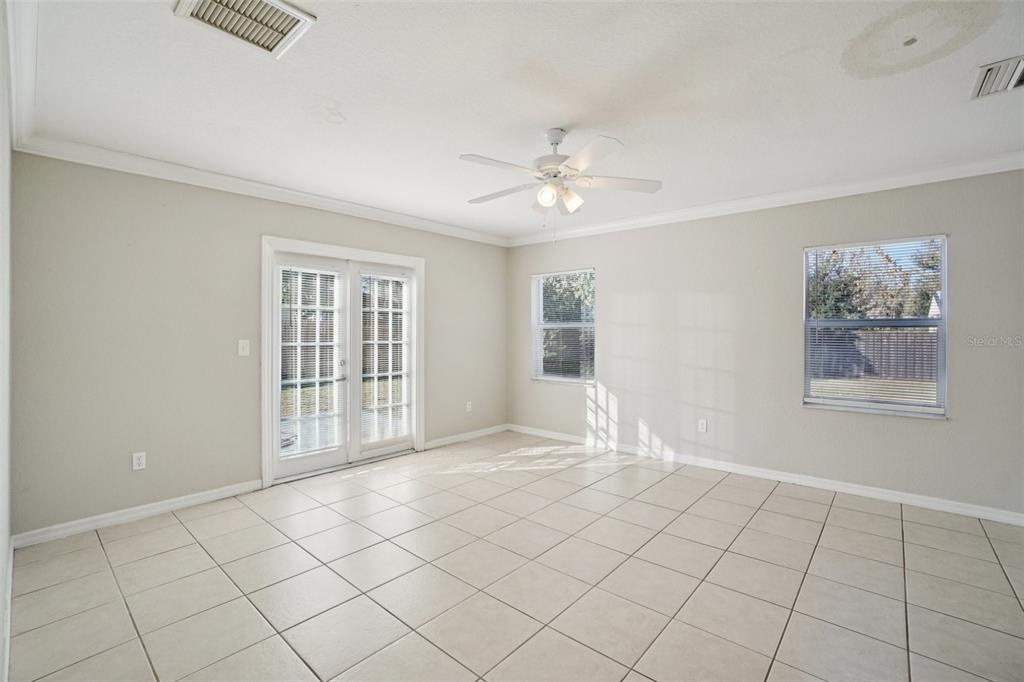 13210 Maple Street Odessa, FL 33556 - Photo 10 of 34 a view of an empty room with a window