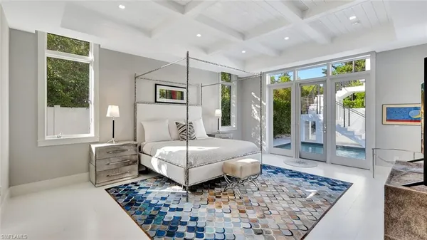 a bedroom with a large bed and a couch