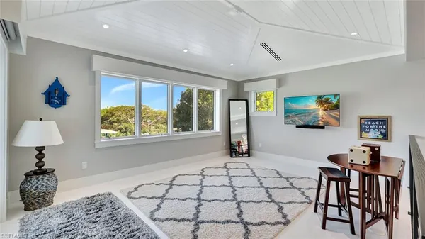 a view of a livingroom with furniture and windows