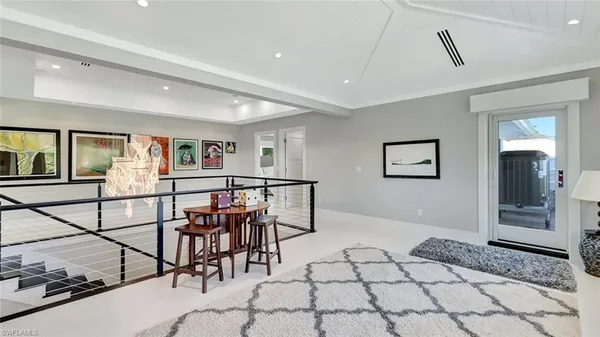a view of a livingroom with furniture and rug