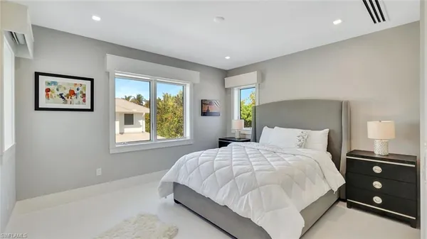 a bathroom with a toilet a sink and a mirror