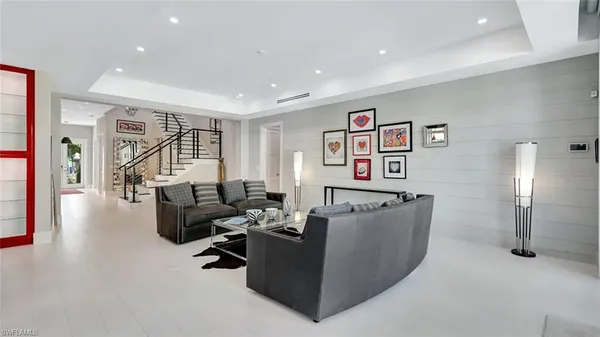 a living room with furniture and a table