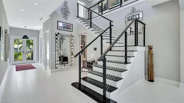 a bathroom with a granite countertop sink a mirror and shower