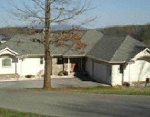 911 3 Quarter Point Road Wirtz, VA 24184 - Photo 4 of 5 a view of a building with a street
