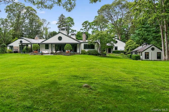 343 Chicken Valley Road Glen Head, NY 11545 - Photo 40 of 49 a front view of a house with garden