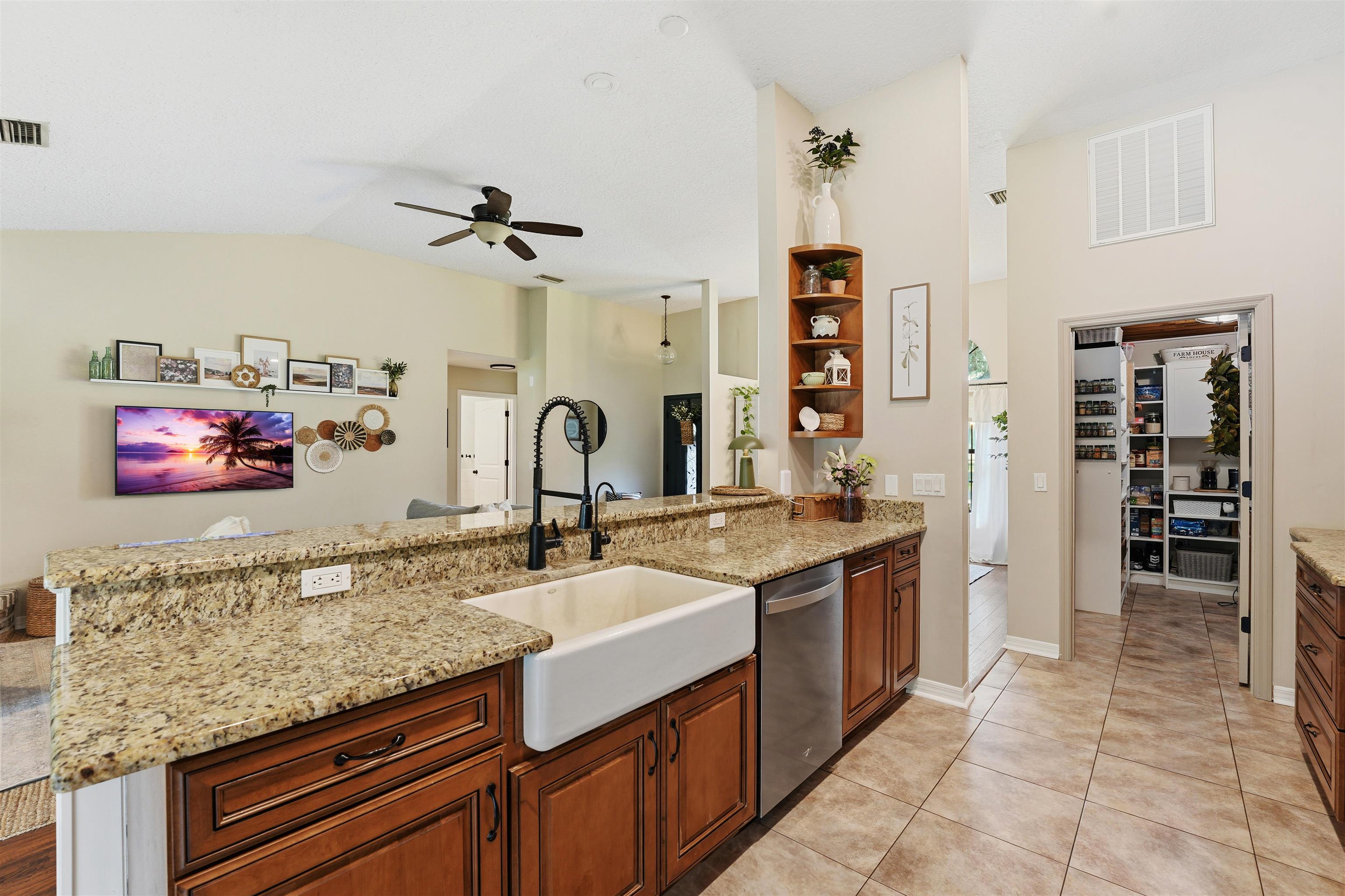 1805 Bennett Road St. Augustine, FL 32092 - Photo 14 of 65 a kitchen with stainless steel appliances granite countertop a sink and cabinets