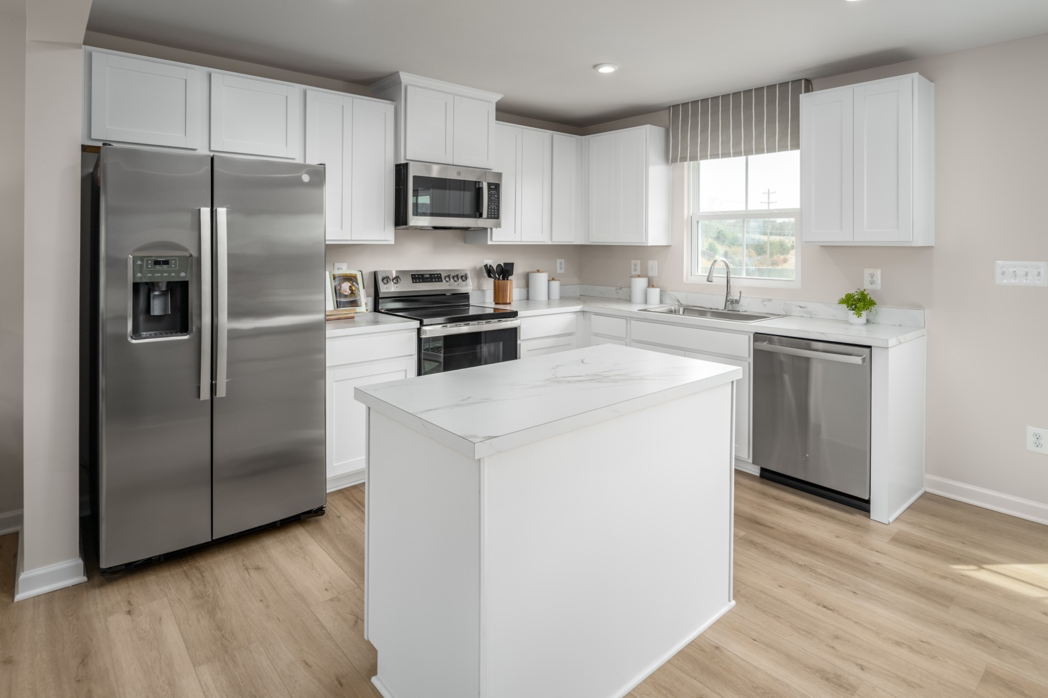 246 Poplar Loop Antioch, TN 37013 - Photo 7 of 21 a kitchen with a refrigerator sink and microwave