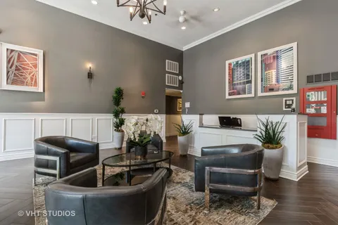 a living room with furniture potted plant and a table