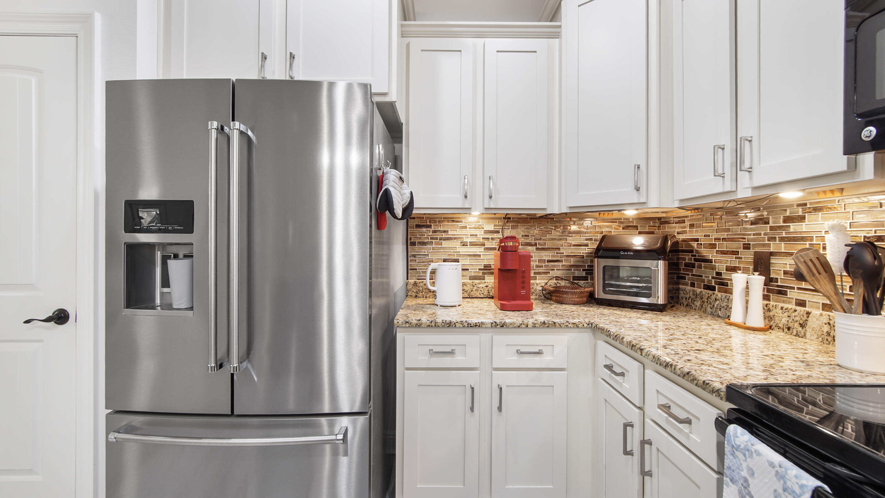 123 Big Oak Lane Santa Rosa Beach, FL 32459 - Photo 15 of 50 a kitchen with stainless steel appliances granite countertop a refrigerator and a stove