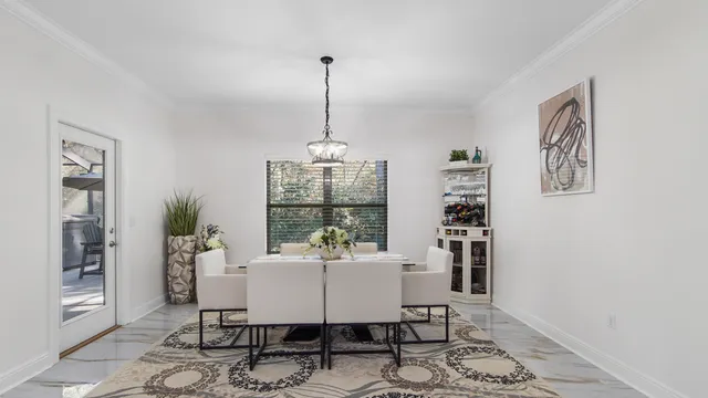 a dining room with furniture and window