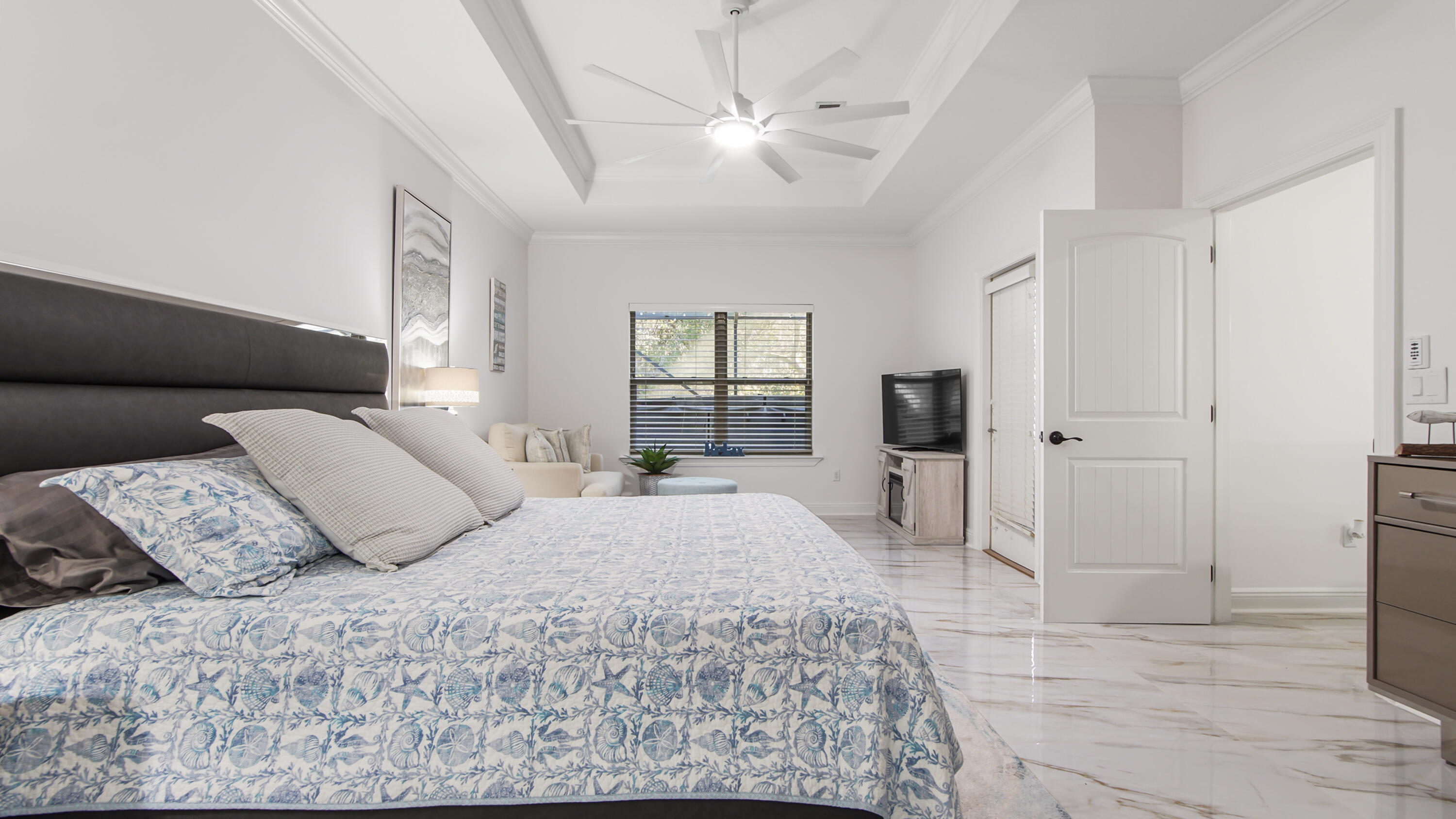 123 Big Oak Lane Santa Rosa Beach, FL 32459 - Photo 19 of 50 a bedroom with a large bed and a chandelier