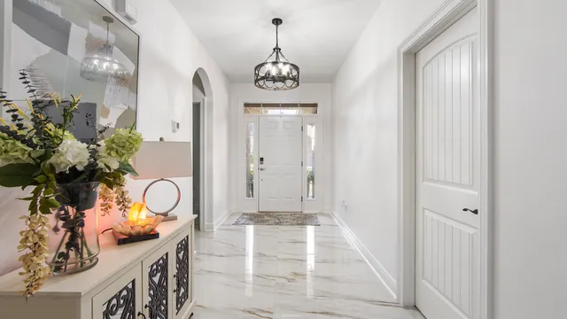 a view of an entryway with wooden floor