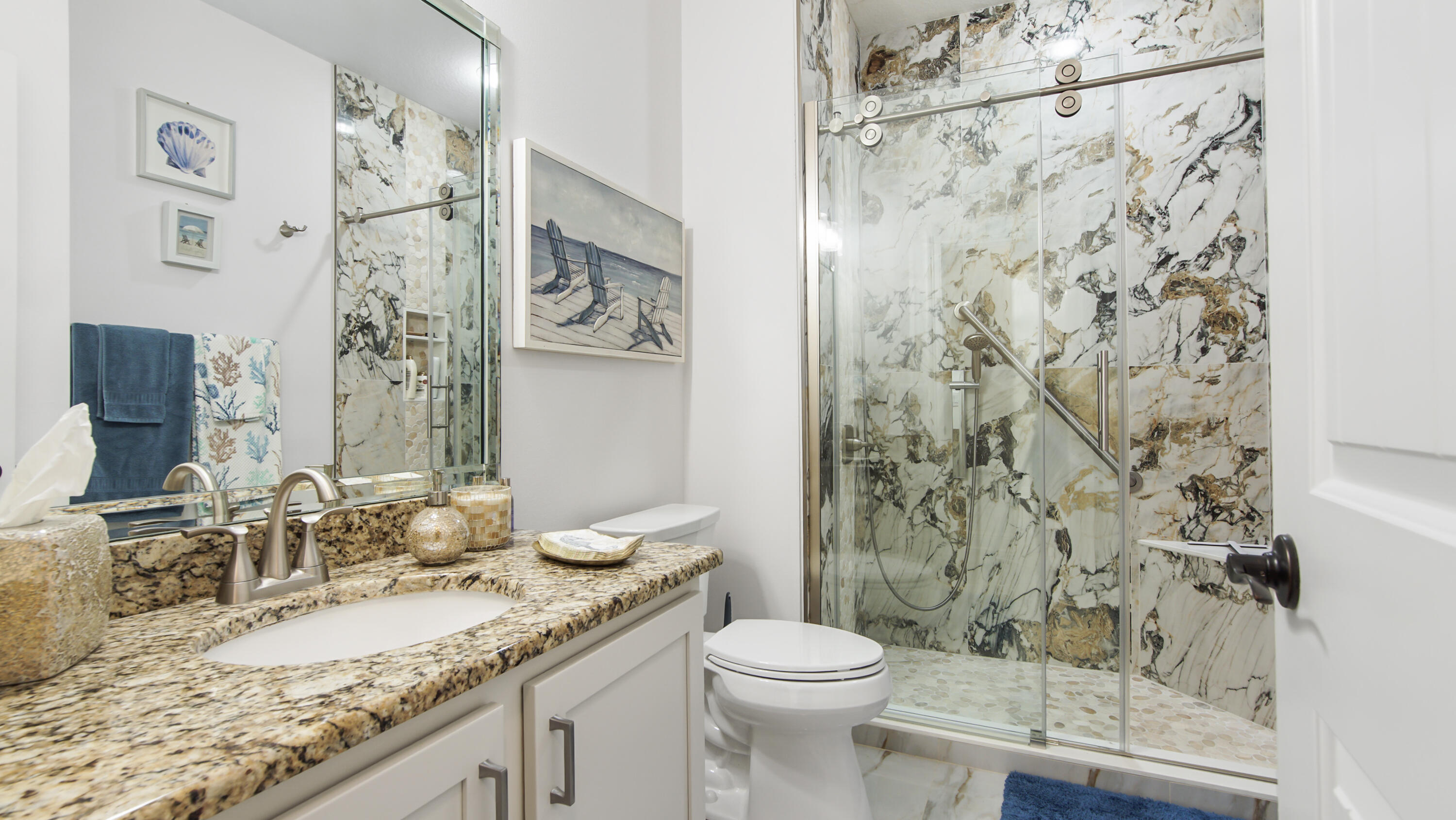 123 Big Oak Lane Santa Rosa Beach, FL 32459 - Photo 25 of 50 a bathroom with a granite countertop sink a toilet and a mirror