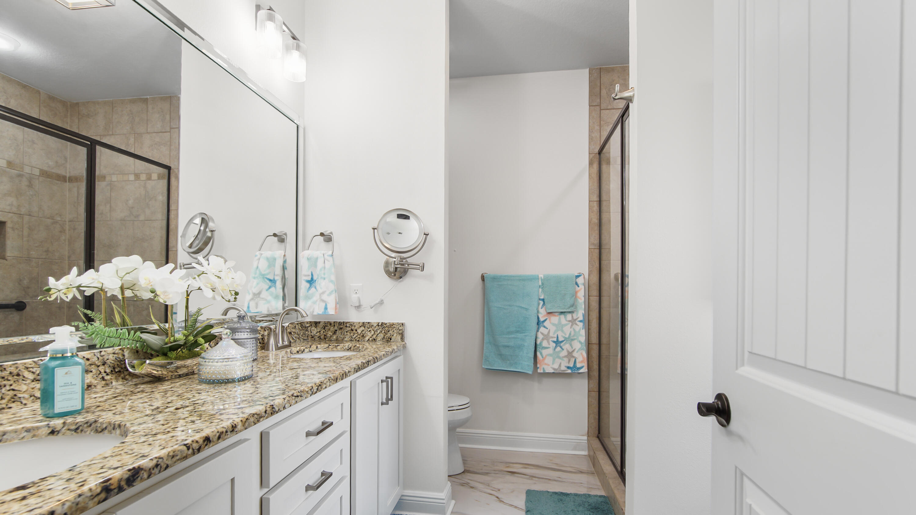 123 Big Oak Lane Santa Rosa Beach, FL 32459 - Photo 27 of 50 a bathroom with a granite countertop sink and a mirror