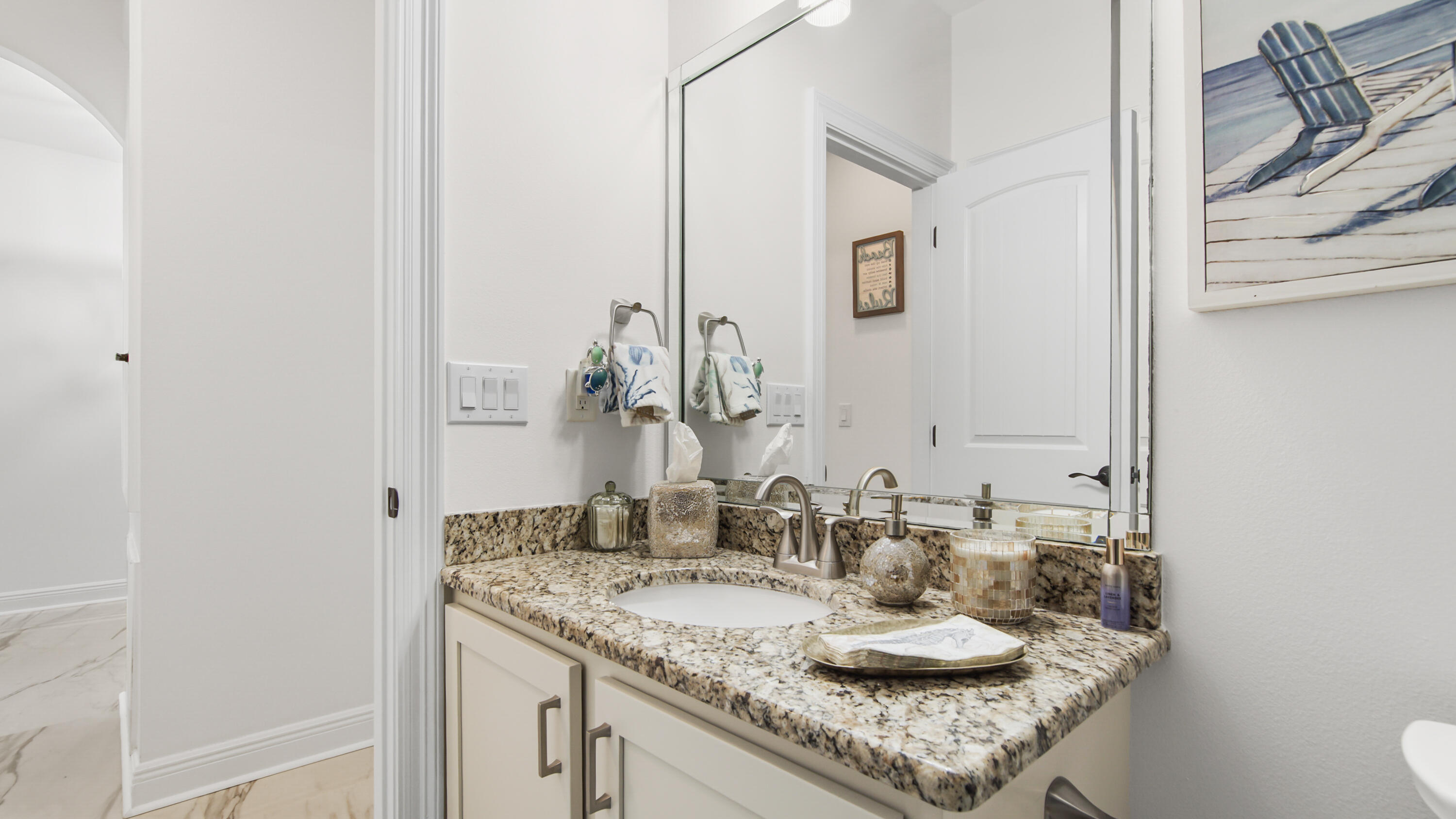 123 Big Oak Lane Santa Rosa Beach, FL 32459 - Photo 28 of 50 a bathroom with a granite countertop sink and a mirror