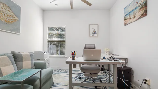 a work room with furniture and a window