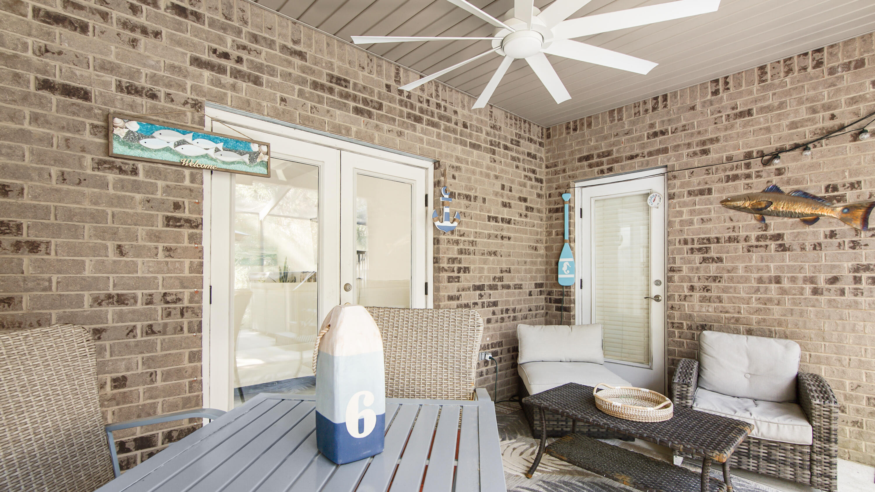 123 Big Oak Lane Santa Rosa Beach, FL 32459 - Photo 37 of 50 a dining room with furniture and wooden floor