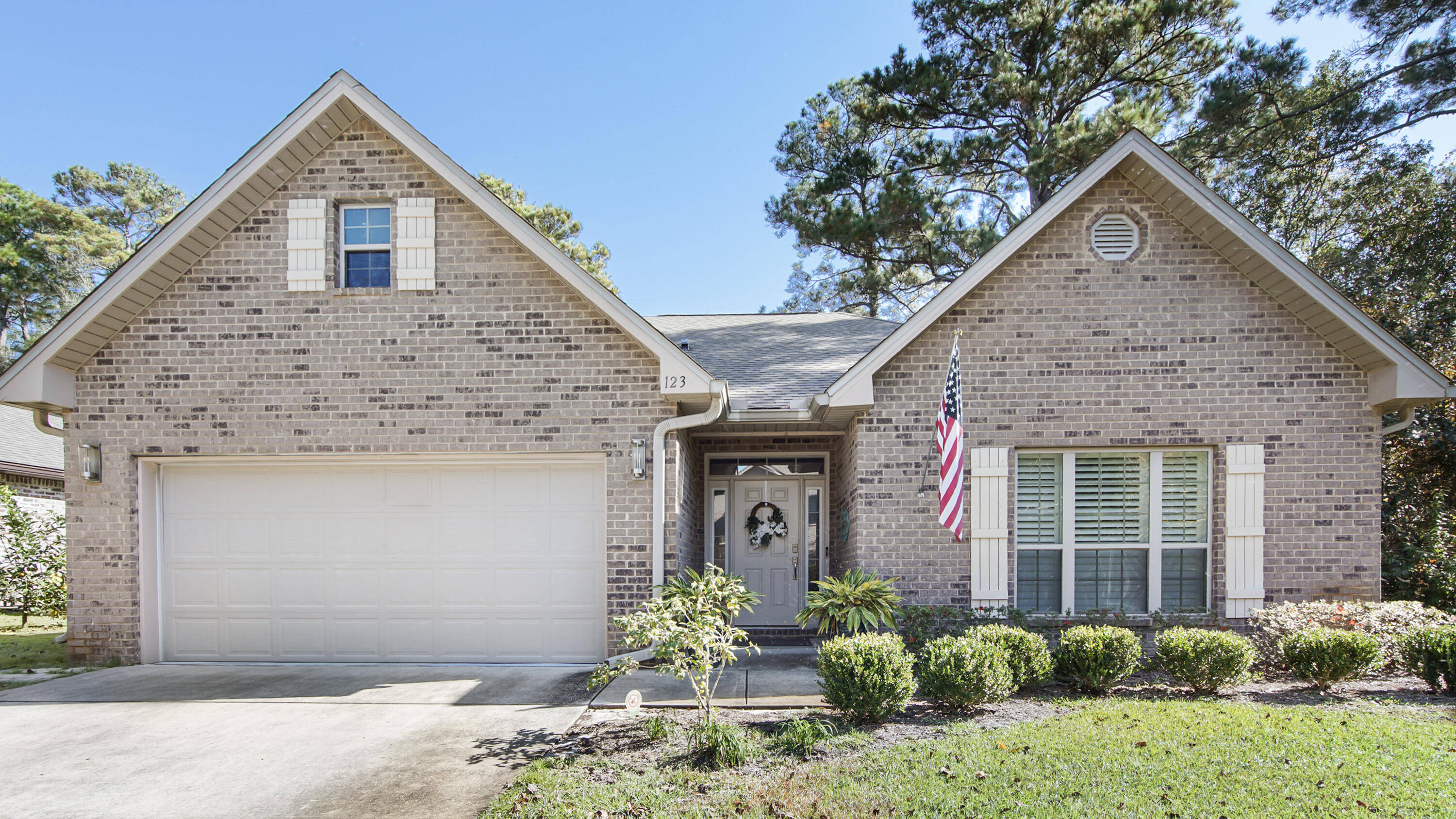 123 Big Oak Lane Santa Rosa Beach, FL 32459 - Photo 7 of 50 a front view of a house with garden