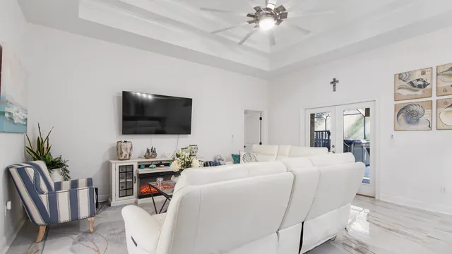 a bedroom with furniture and a flat screen tv