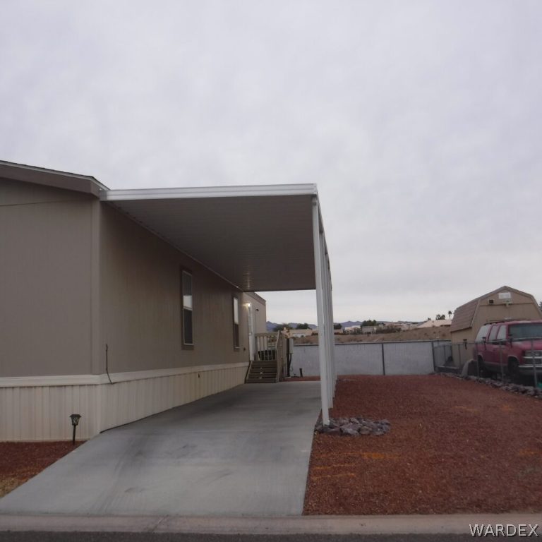 2066 East El Rodeo Road, Unit 31 Fort Mohave, AZ 86426 - Photo 3 of 12 a view of balcony and car parked