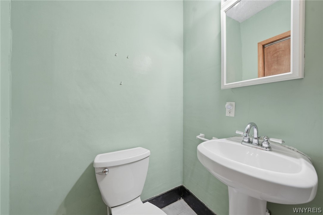 65 Hammerschmidt Avenue Buffalo, NY 14210 - Photo 13 of 30 Half Bathroom & Laundry