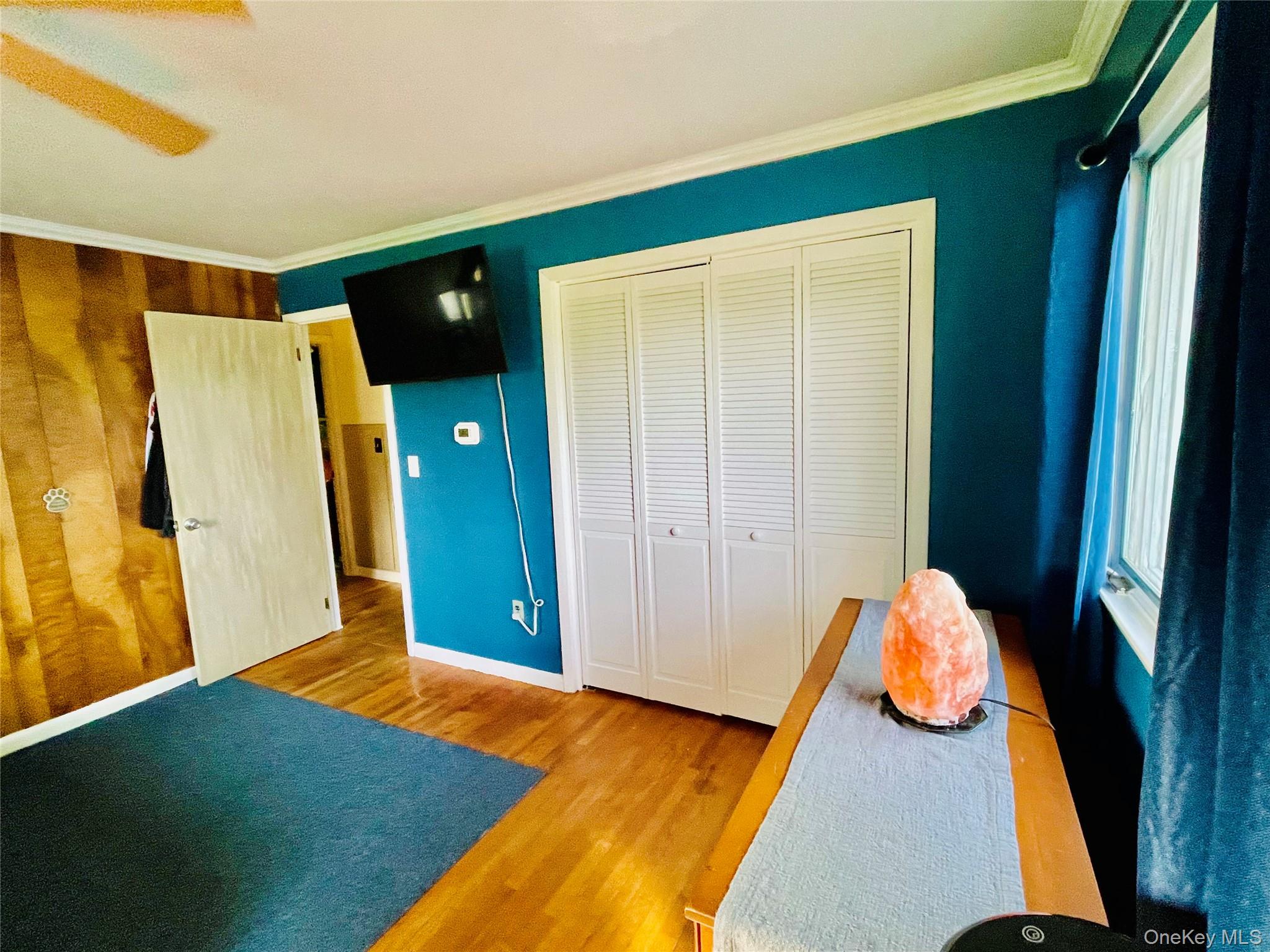 137 Cross Road Goshen, NY 10924 - Photo 19 of 50 a bedroom with a bed and wooden floor