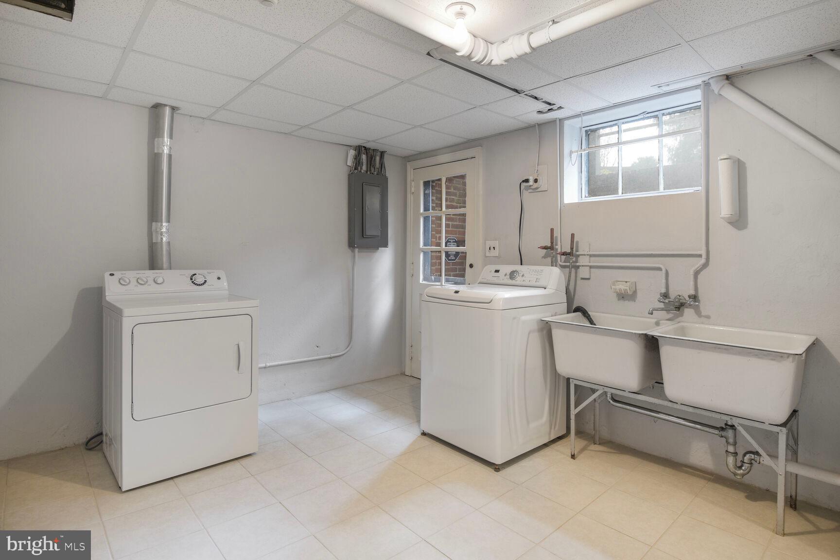 1200 Highland Drive Silver Spring, MD 20910 - Photo 31 of 39 Laundry room w/rear exit door & chute from 1st/2nd