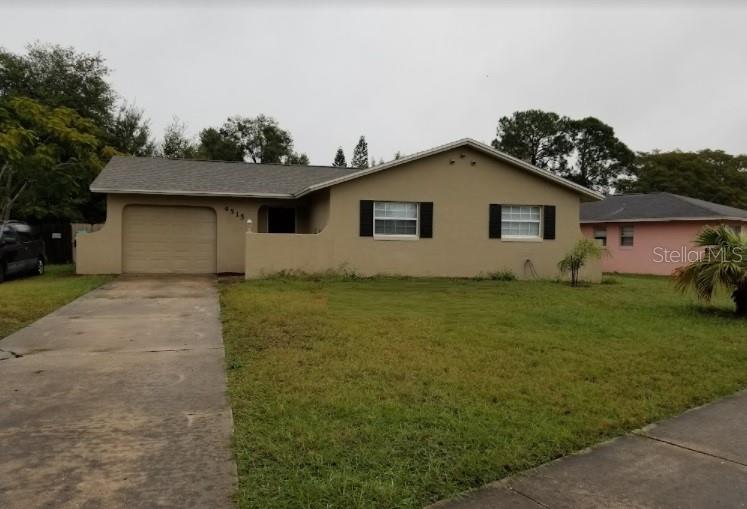 4515 Chateau Road Orlando, FL 32808 - Photo 1 of 1 a house view with a garden space