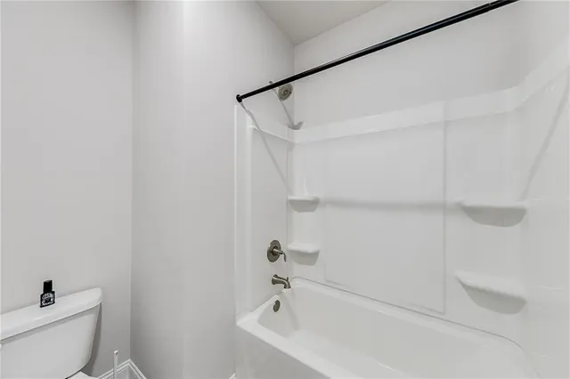 an aerial view of a house with swimming pool garden and patio