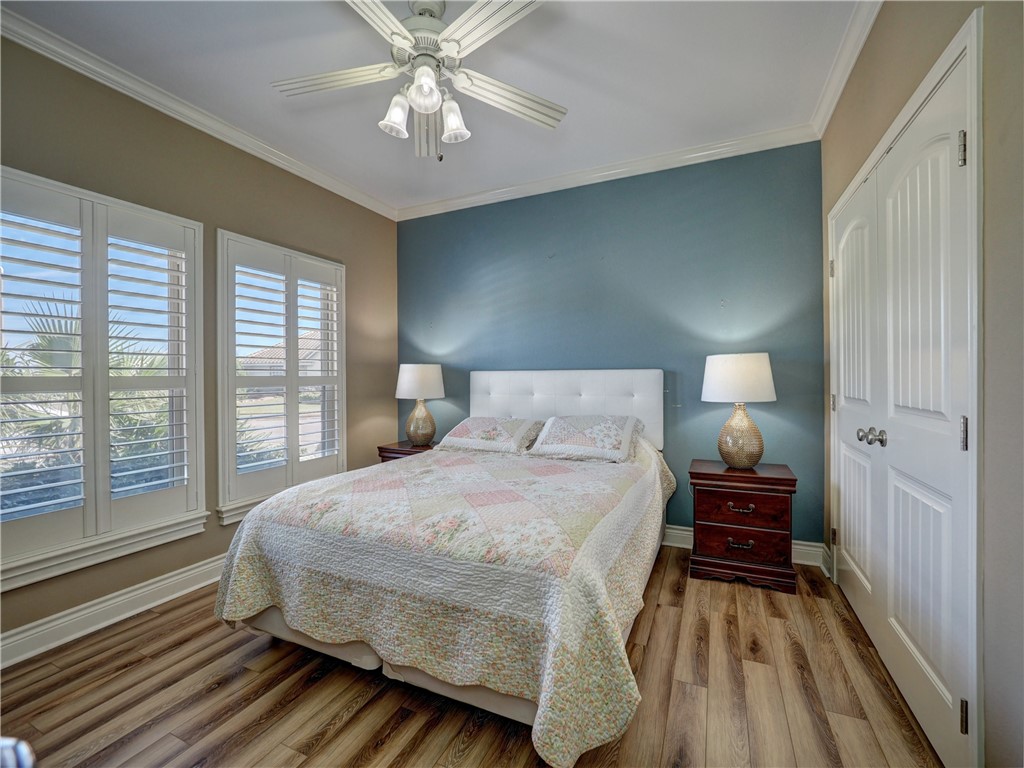 204 Black Diamond Road Portland, TX 78374 - Photo 17 of 40 a bedroom with a bed and a large window
