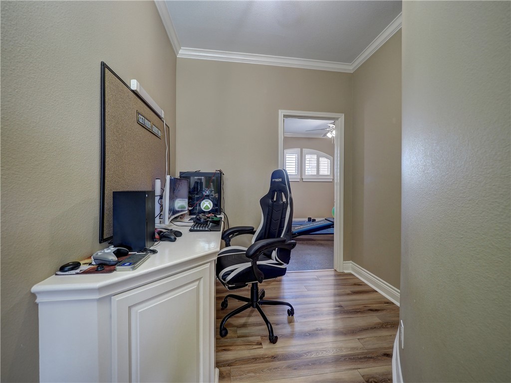 204 Black Diamond Road Portland, TX 78374 - Photo 28 of 40 a view of a workspace with furniture and wooden floor