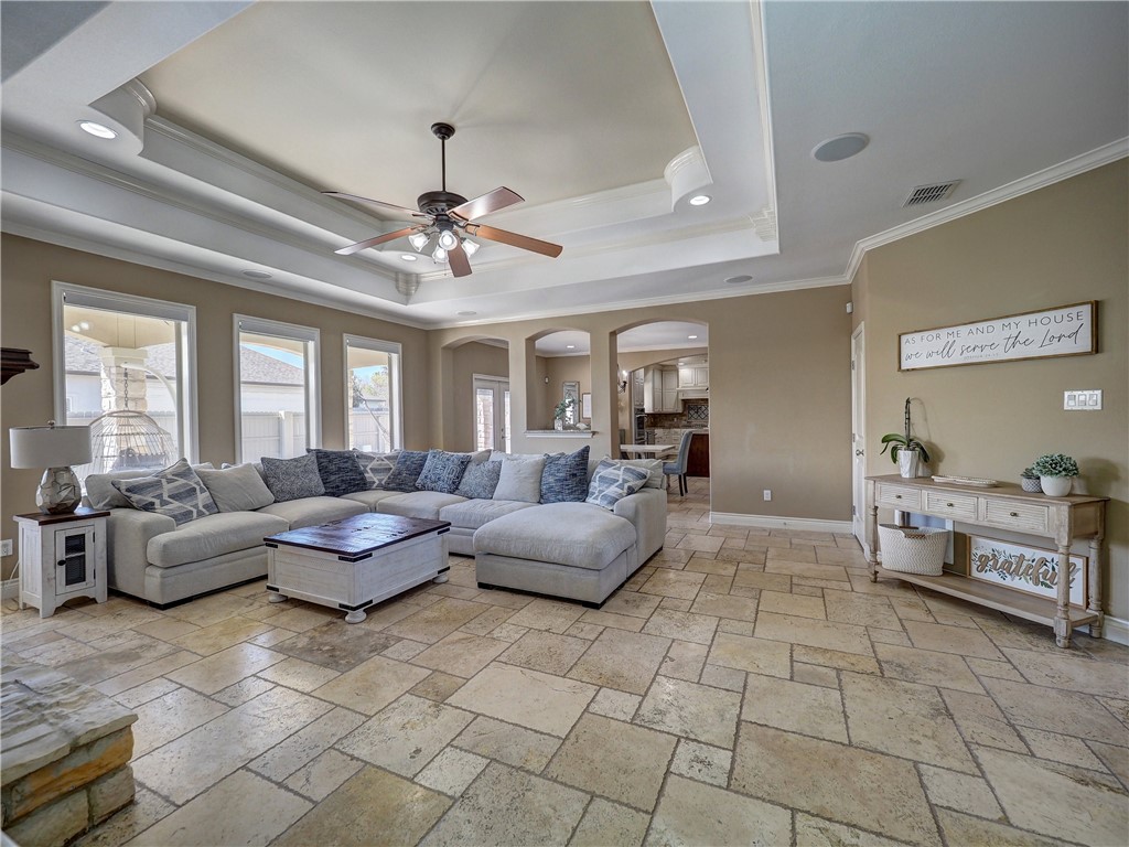 204 Black Diamond Road Portland, TX 78374 - Photo 5 of 40 a living room with furniture and a chandelier