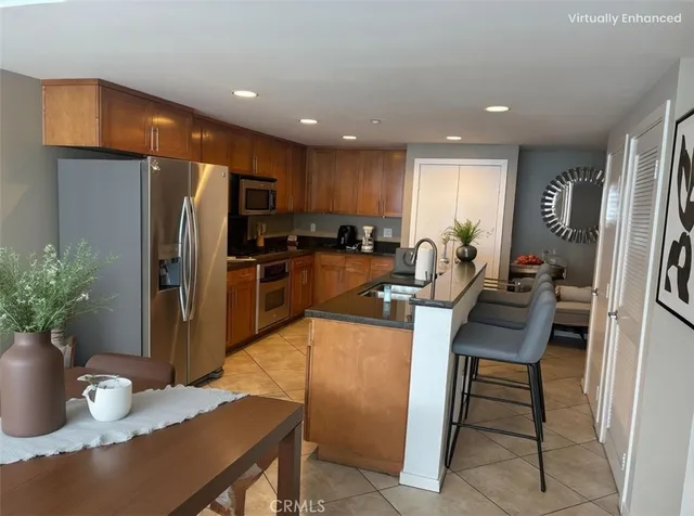 a kitchen with a table and chairs