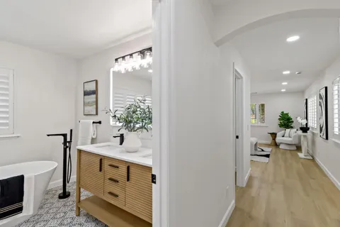 a bathroom with a toilet sink and shower