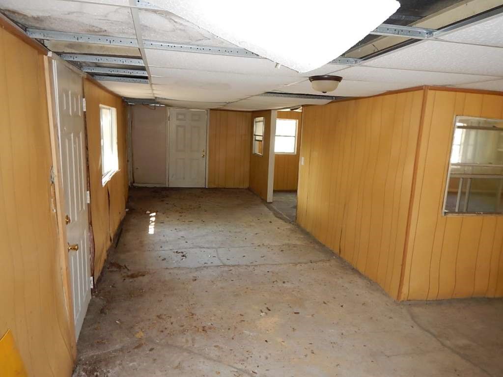 3614 Cosby Street Houston, TX 77021 - Photo 15 of 16 a view of a hallway with wooden shelves