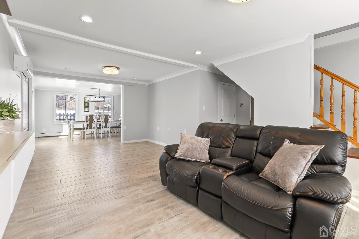 22 Altamont Road Edison, NJ 08817 - Photo 30 of 31 a living room with furniture and a wooden floor