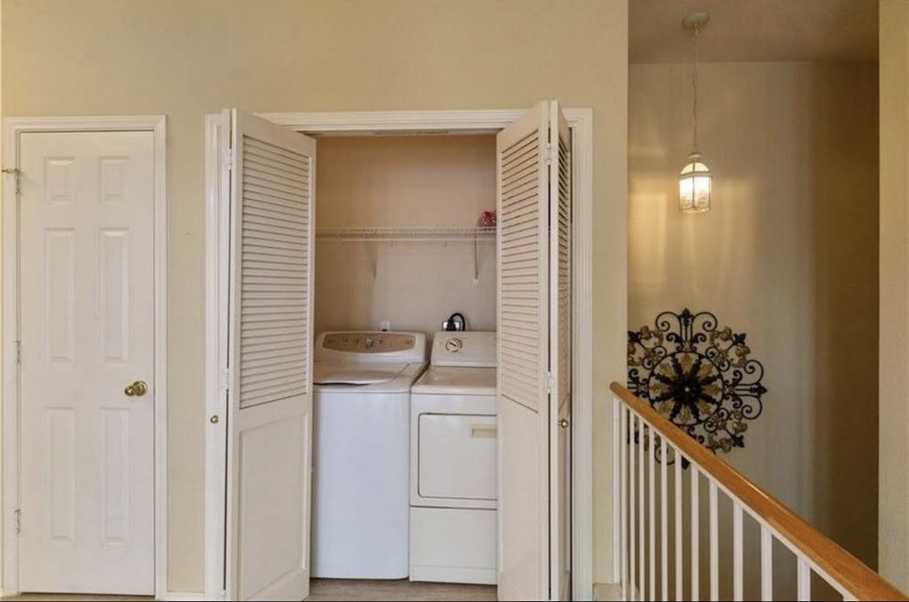 1900 Scofield Ridge Parkway, Unit 3101 Austin, TX 78727 - Photo 19 of 24 Laundry closet featuring louvered bi-fold doors, a washer, and a dryer