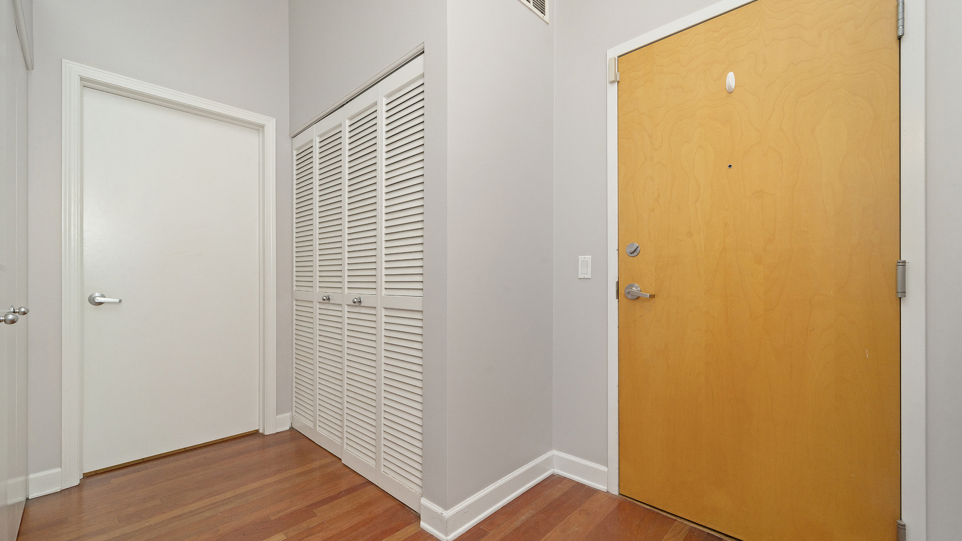 1301 West Madison Street, Unit 304 Chicago, IL 60607 - Photo 14 of 15 a view of a room with wooden floor and a window