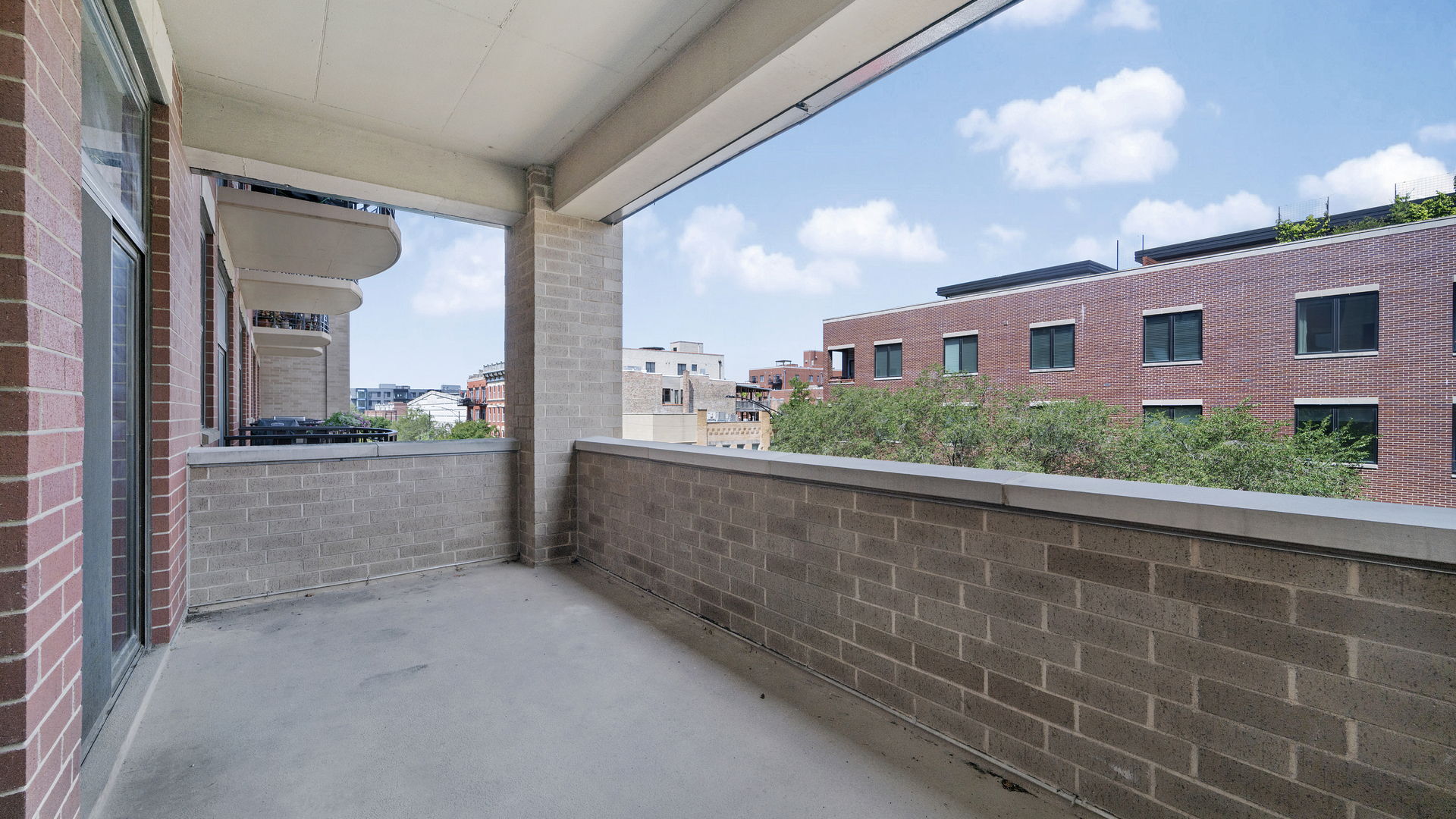 1301 West Madison Street, Unit 304 Chicago, IL 60607 - Photo 3 of 15 a view of balcony and kitchen