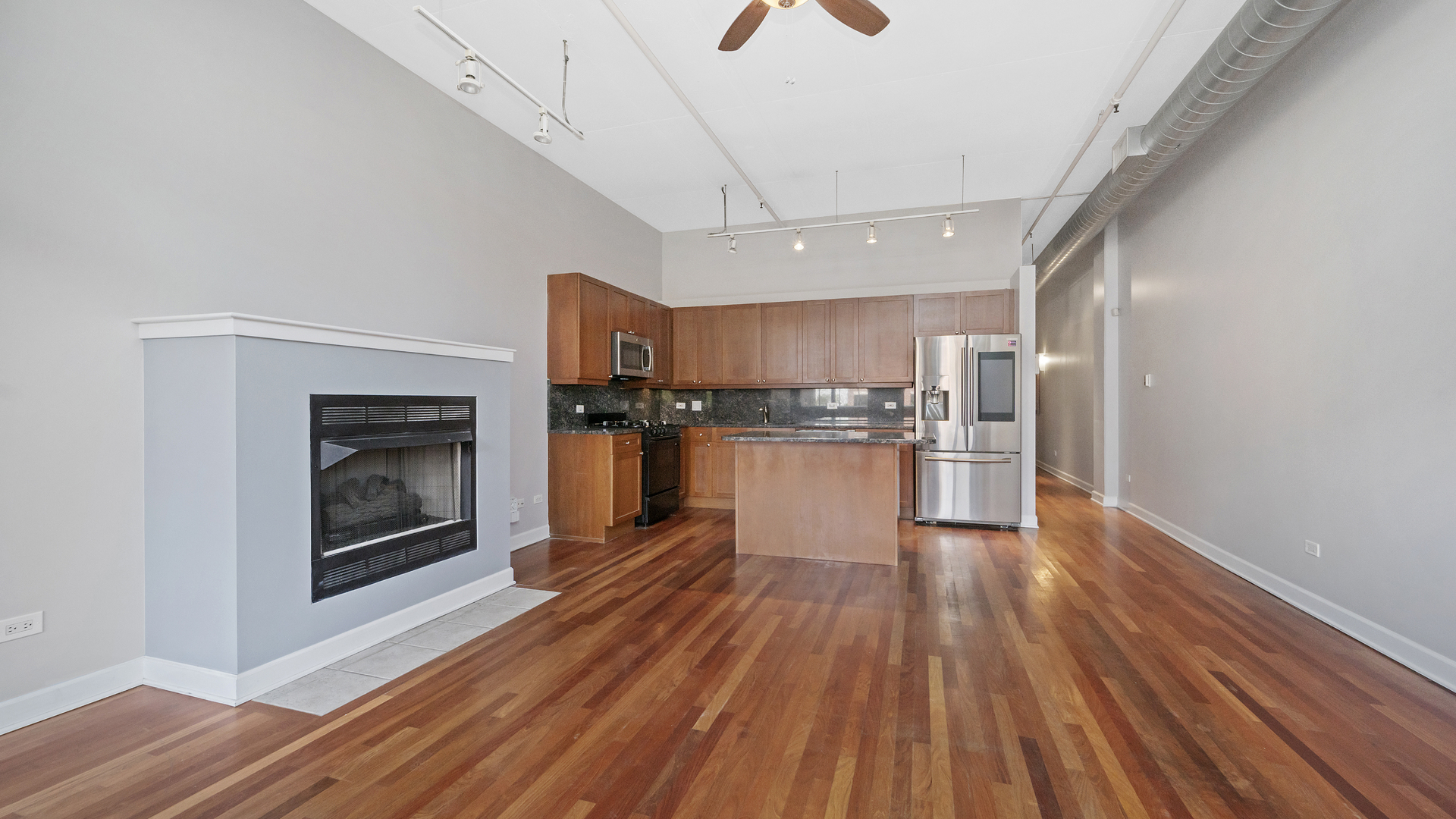 1301 West Madison Street, Unit 304 Chicago, IL 60607 - Photo 6 of 15 a view of kitchen view wooden floors appliances and cabinets