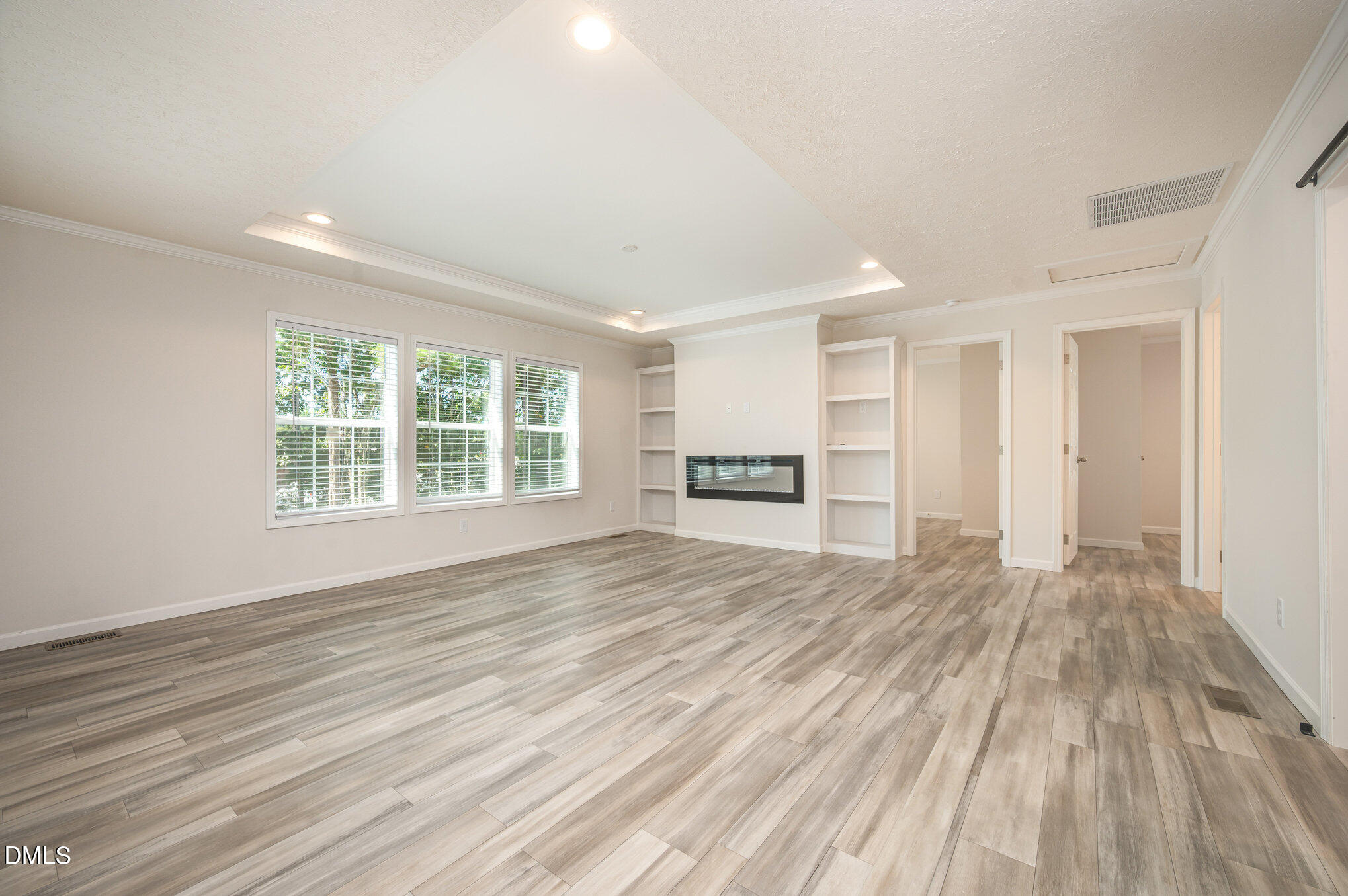 2551 Old Durham Road Roxboro, NC 27573 - Photo 13 of 28 a view of empty room with wooden floor and fan
