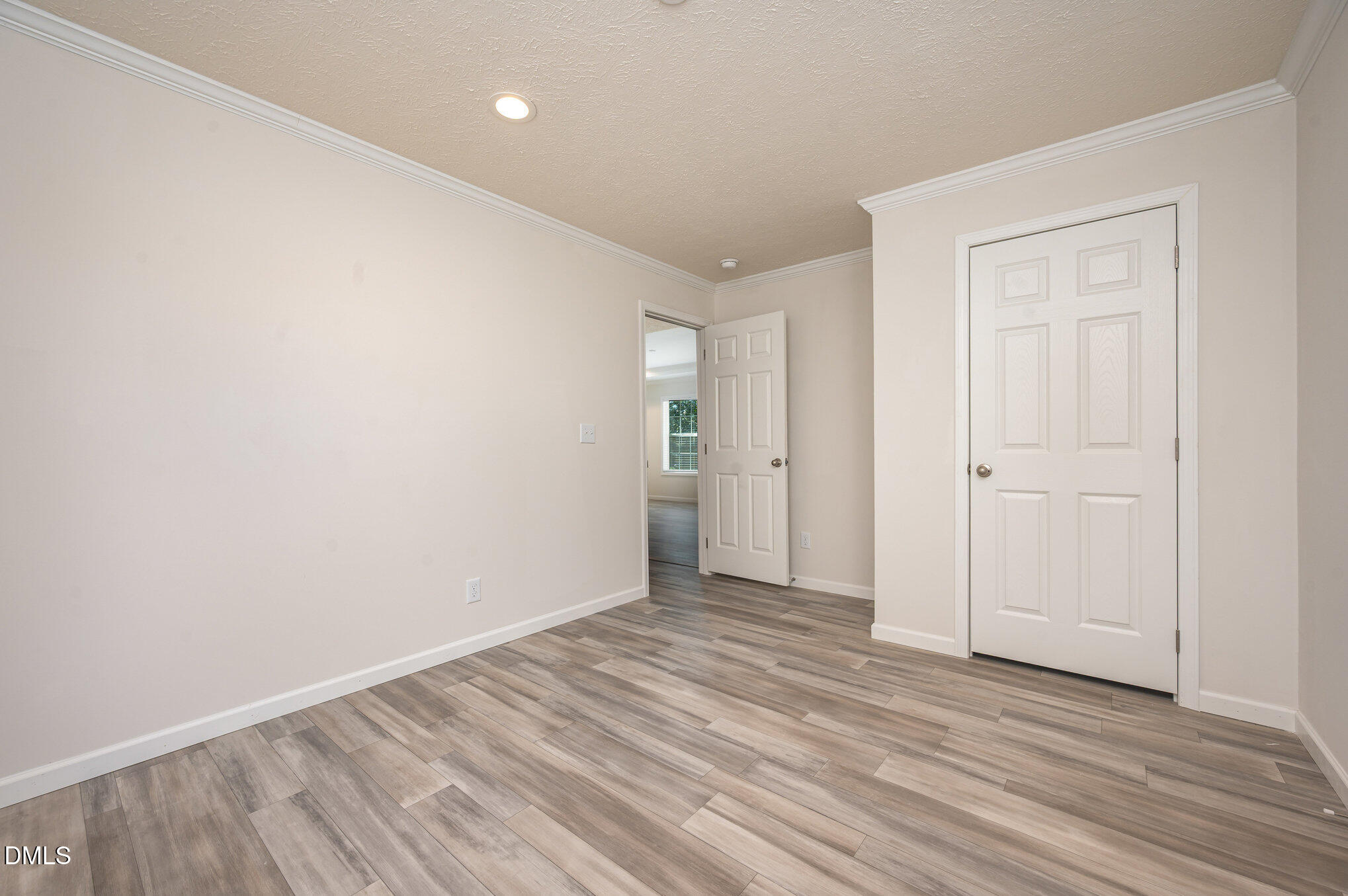 2551 Old Durham Road Roxboro, NC 27573 - Photo 14 of 28 a view of an empty room with wooden floor