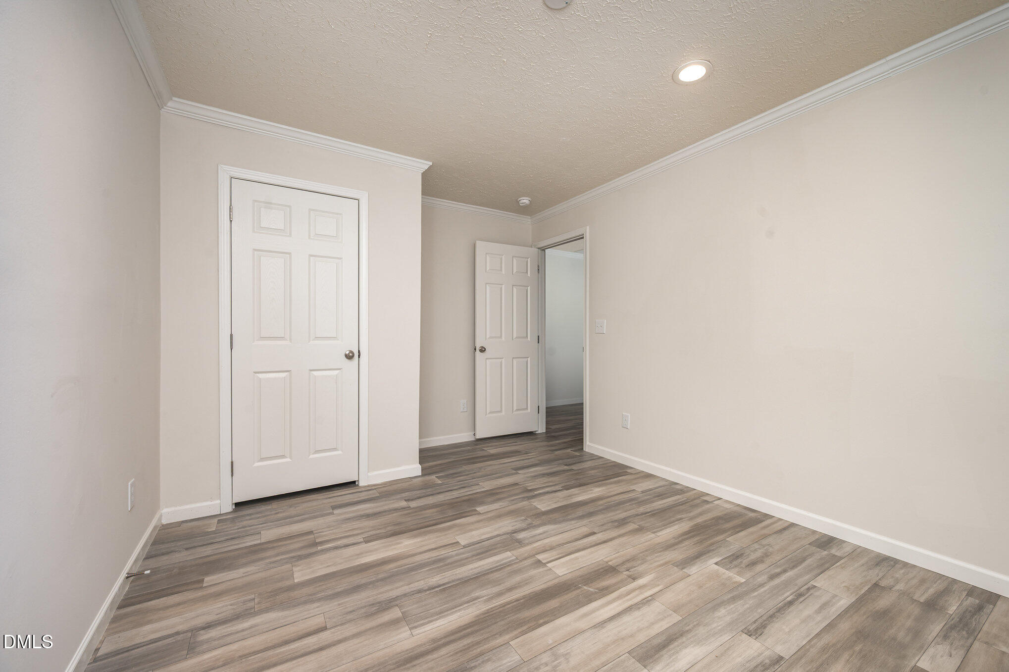 2551 Old Durham Road Roxboro, NC 27573 - Photo 15 of 28 a view of an empty room with wooden floor