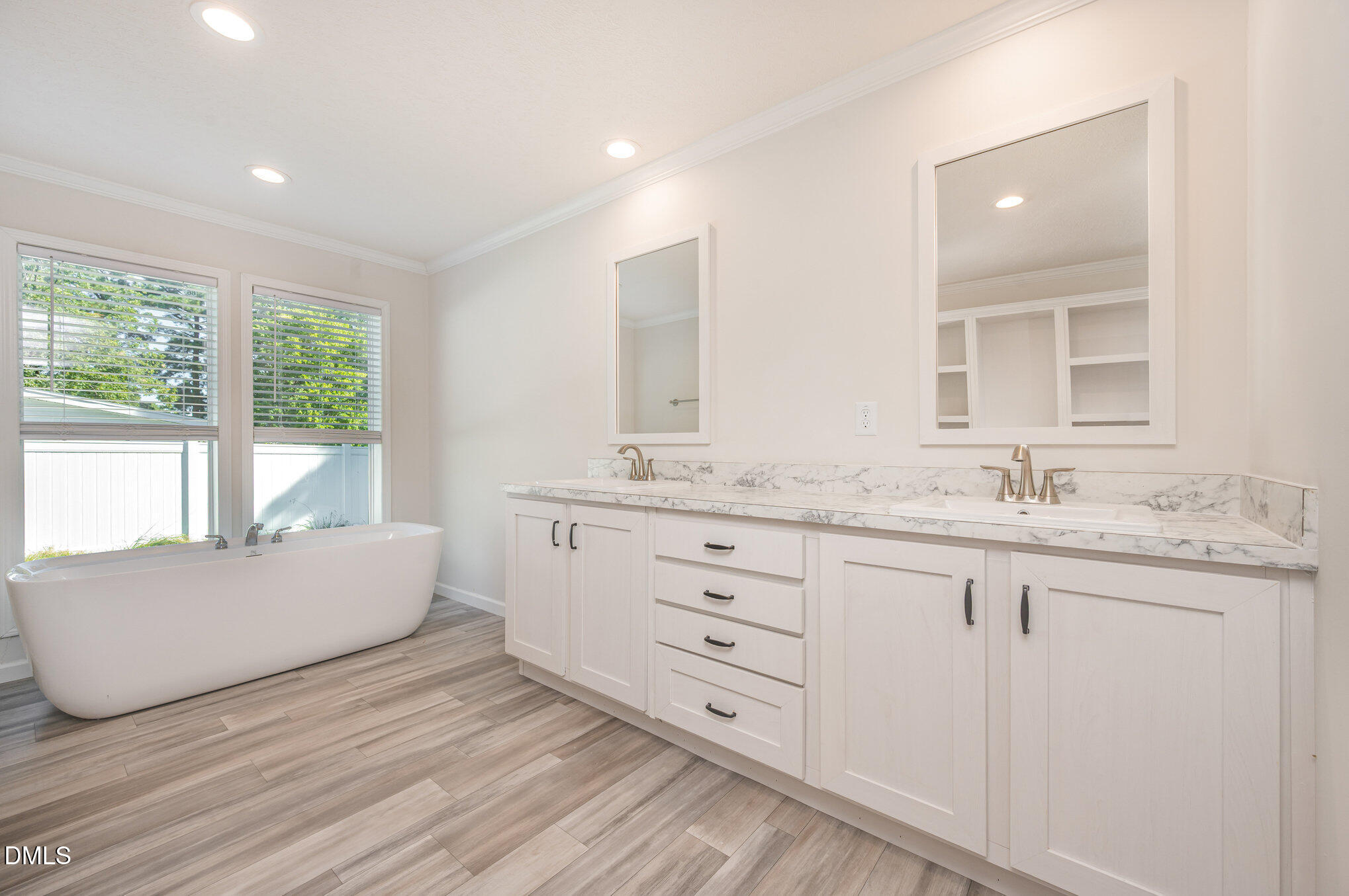 2551 Old Durham Road Roxboro, NC 27573 - Photo 2 of 28 a spacious bathroom with double vanity and a mirror