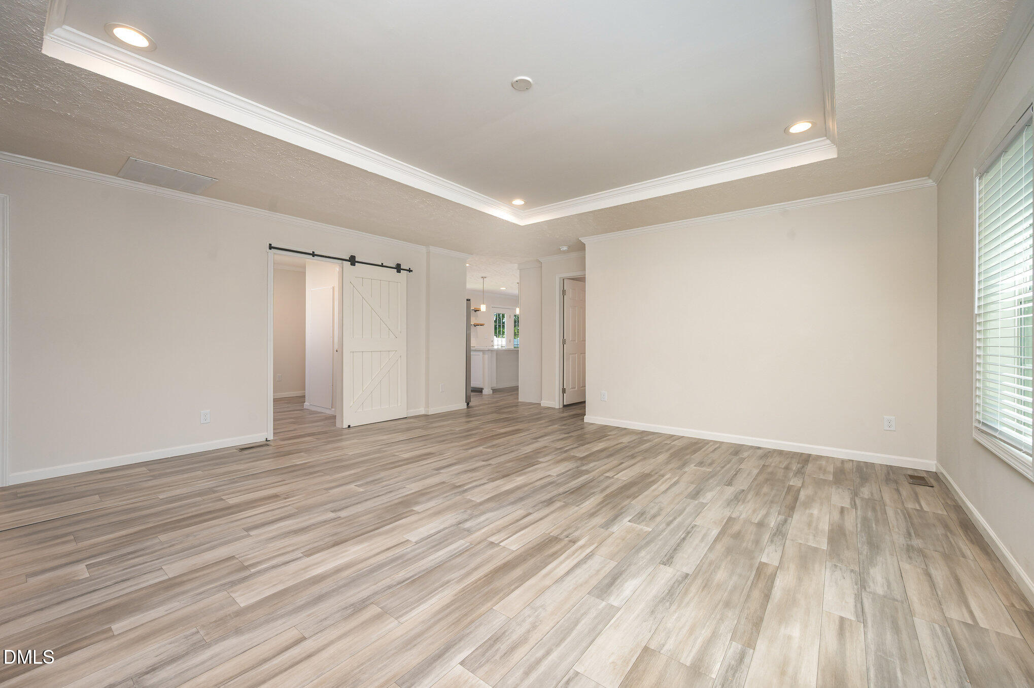 2551 Old Durham Road Roxboro, NC 27573 - Photo 21 of 28 wooden floor in an empty room with a window