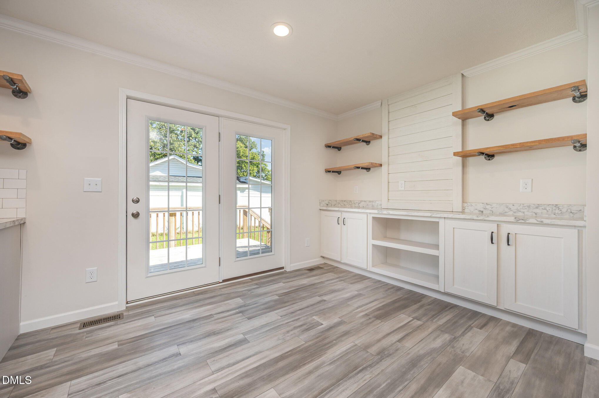 2551 Old Durham Road Roxboro, NC 27573 - Photo 23 of 28 a view of a kitchen and an empty room with a window