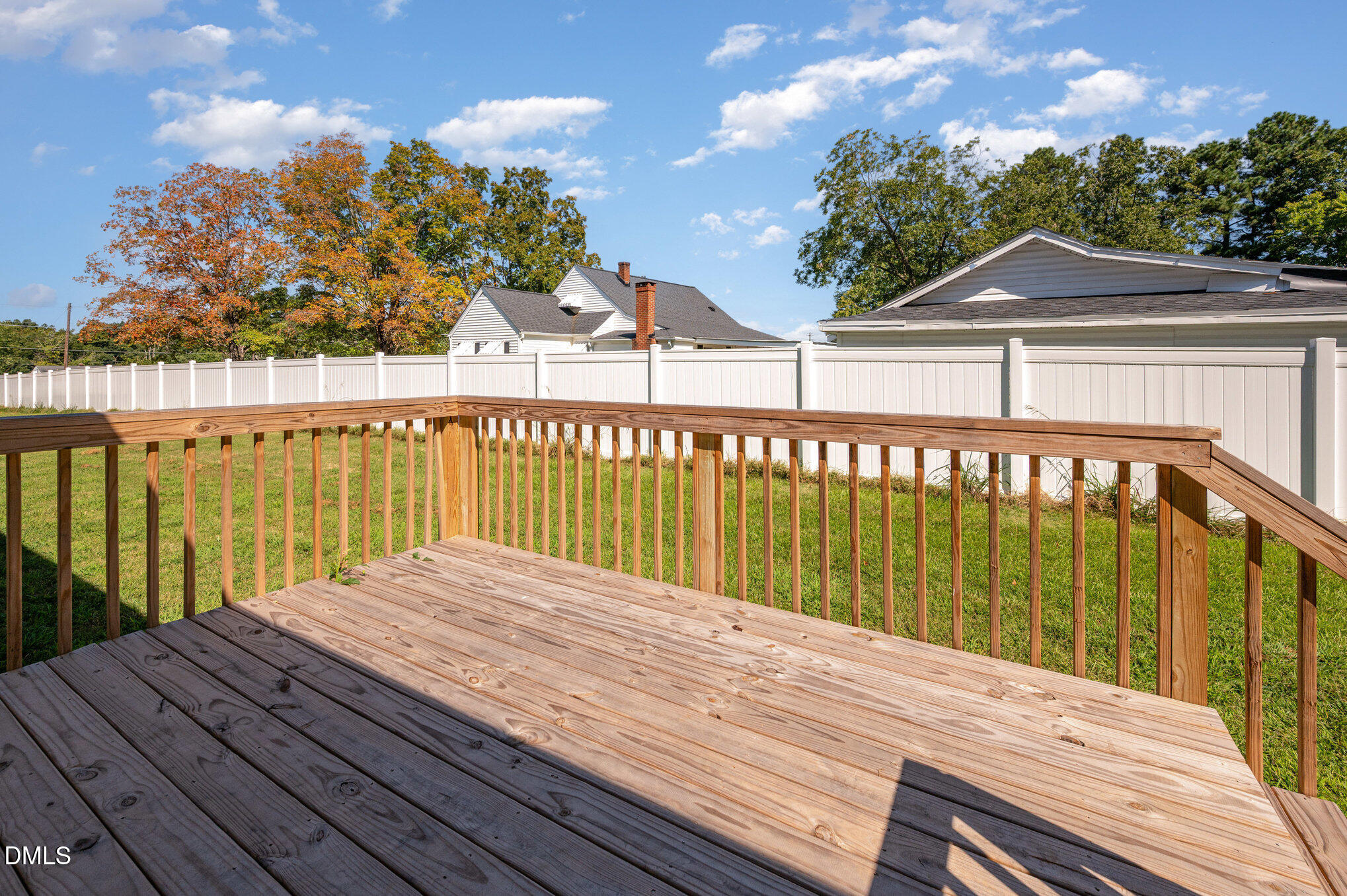 2551 Old Durham Road Roxboro, NC 27573 - Photo 24 of 28 a view of a wooden deck with a garden