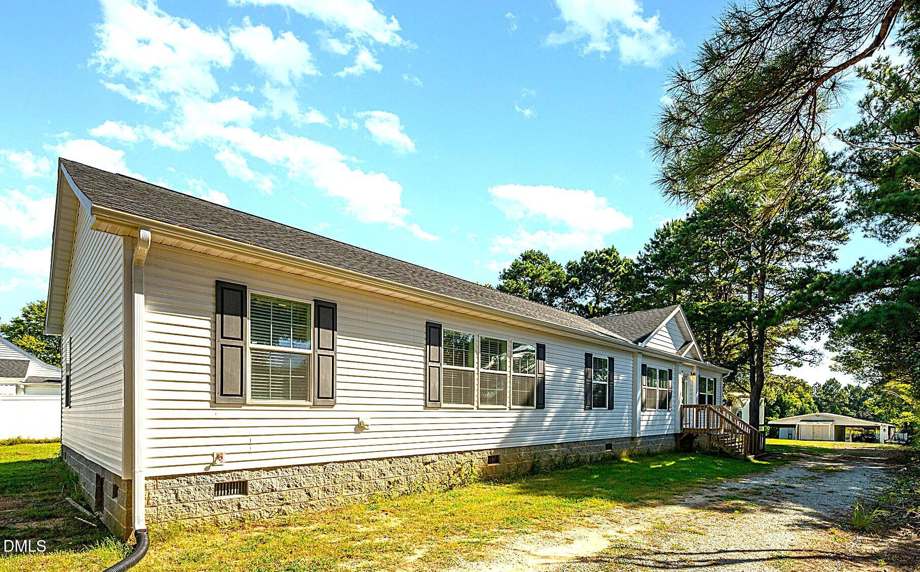 2551 Old Durham Road Roxboro, NC 27573 - Photo 3 of 28 a front view of a house with a yard